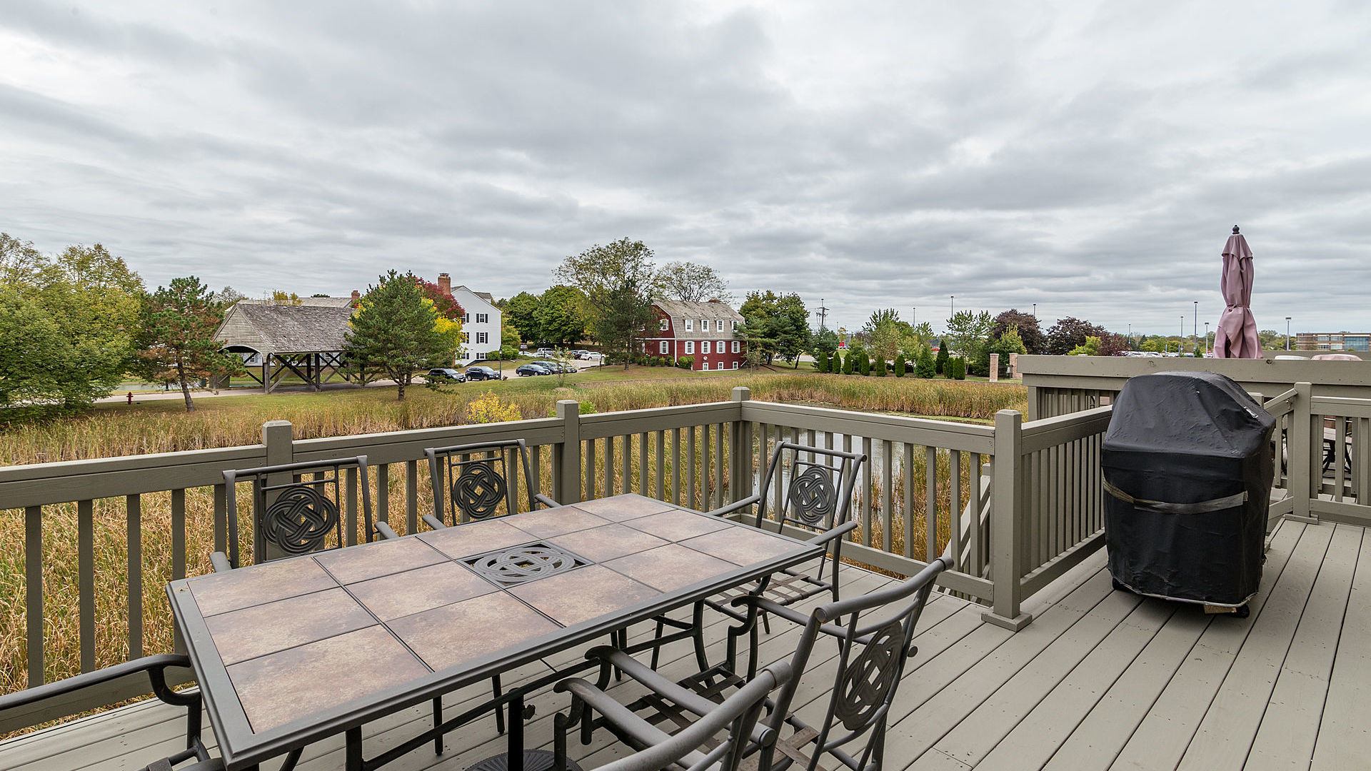 1412 Rue Paris Place Palatine, IL 60067 - Photo 17 of 20 a view of a deck with two chairs and a table