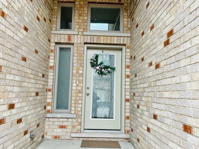 1412 Rue Paris Place Palatine, IL 60067 - Photo 2 of 20 a view of a door of a brick building