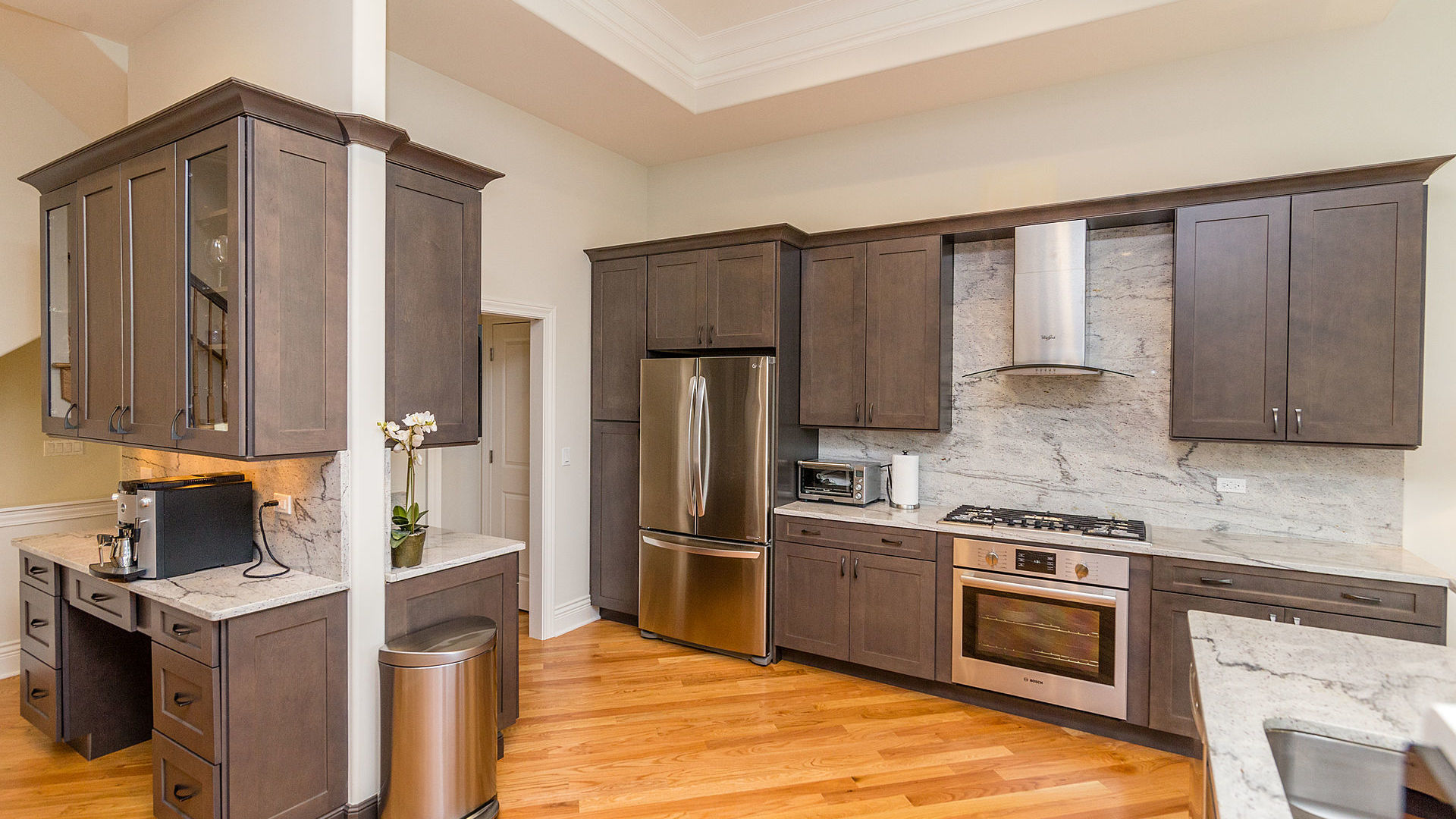 1412 Rue Paris Place Palatine, IL 60067 - Photo 5 of 20 a kitchen with kitchen island granite countertop wooden cabinets and stainless steel appliances