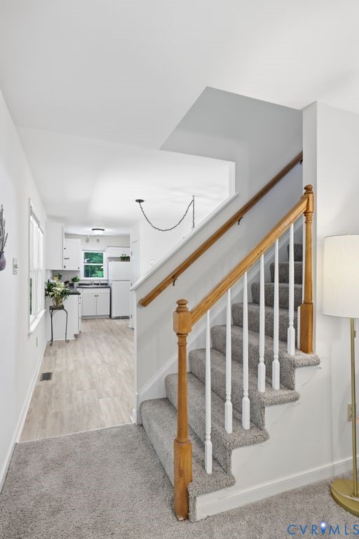 4301 Boones Bluff Way Chesterfield, VA 23832 - Photo 14 of 31 Rear Staircase leading upstairs