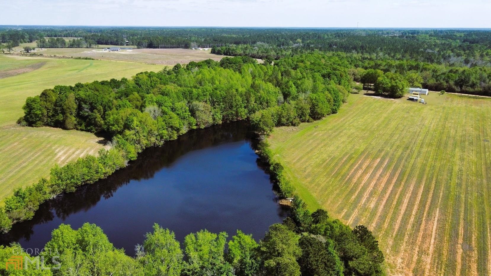 a view of a lake with a yard
