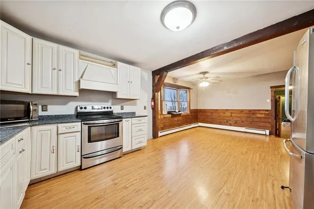 a kitchen with granite countertop a stove and a sink