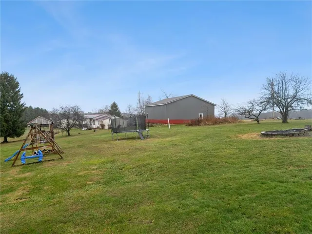 a view of a house with a big yard