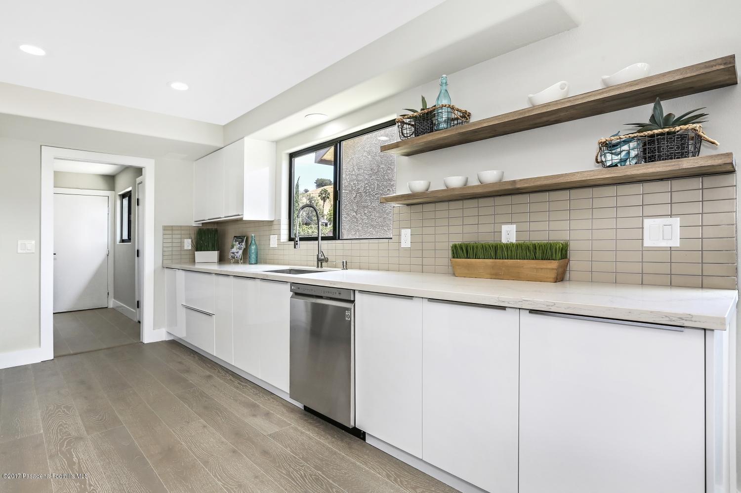 4614 Townsend Avenue Los Angeles, CA 90041 - Photo 12 of 38 a kitchen with stainless steel appliances a sink and cabinets
