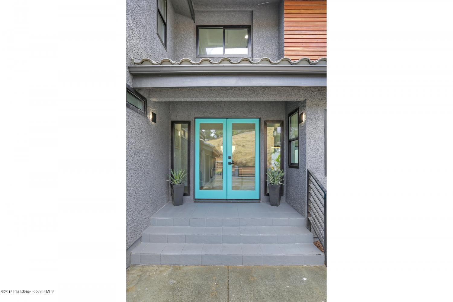 4614 Townsend Avenue Los Angeles, CA 90041 - Photo 5 of 38 a view of a hallway with a large window and potted plants
