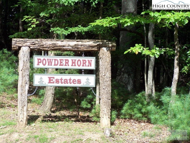 Elk Ridge Road Deep Gap, NC 28618 - Photo 11 of 47 a sign that is sitting on a brick wall