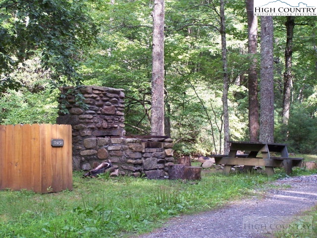 Elk Ridge Road Deep Gap, NC 28618 - Photo 12 of 47 a backyard of a house with lots of green space