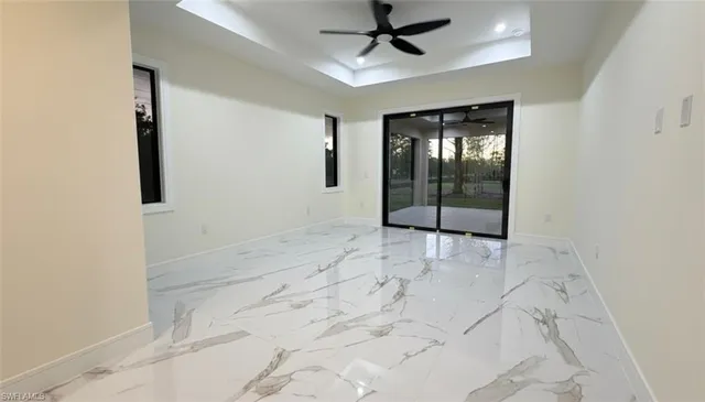 a white toilet sitting next to a shower
