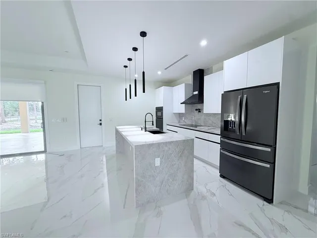 a bedroom with a bed couch and a window