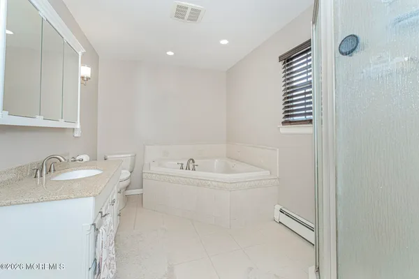 a bathroom with a double vanity sink and mirror