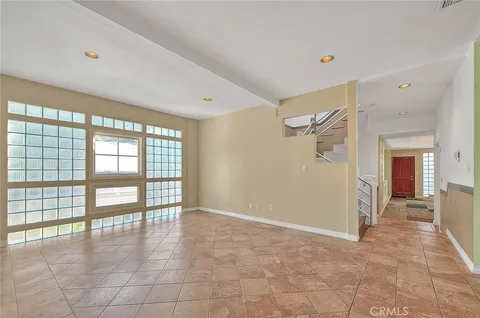 a kitchen with stainless steel appliances granite countertop a sink and a stove