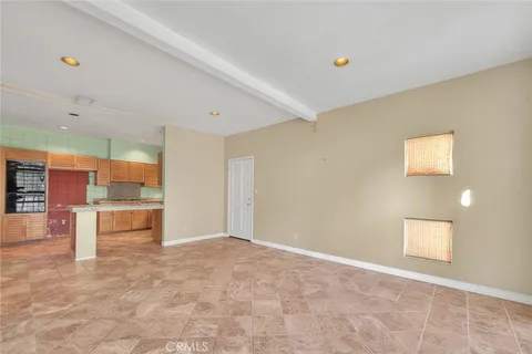 a large kitchen with stainless steel appliances granite countertop a sink and cabinets