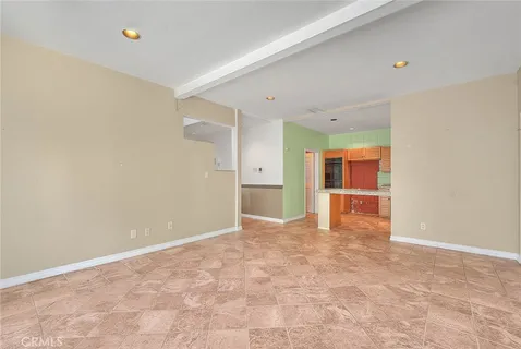 a kitchen with granite countertop a sink and a window