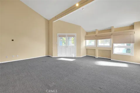 a view of hallway with bathroom and a sink