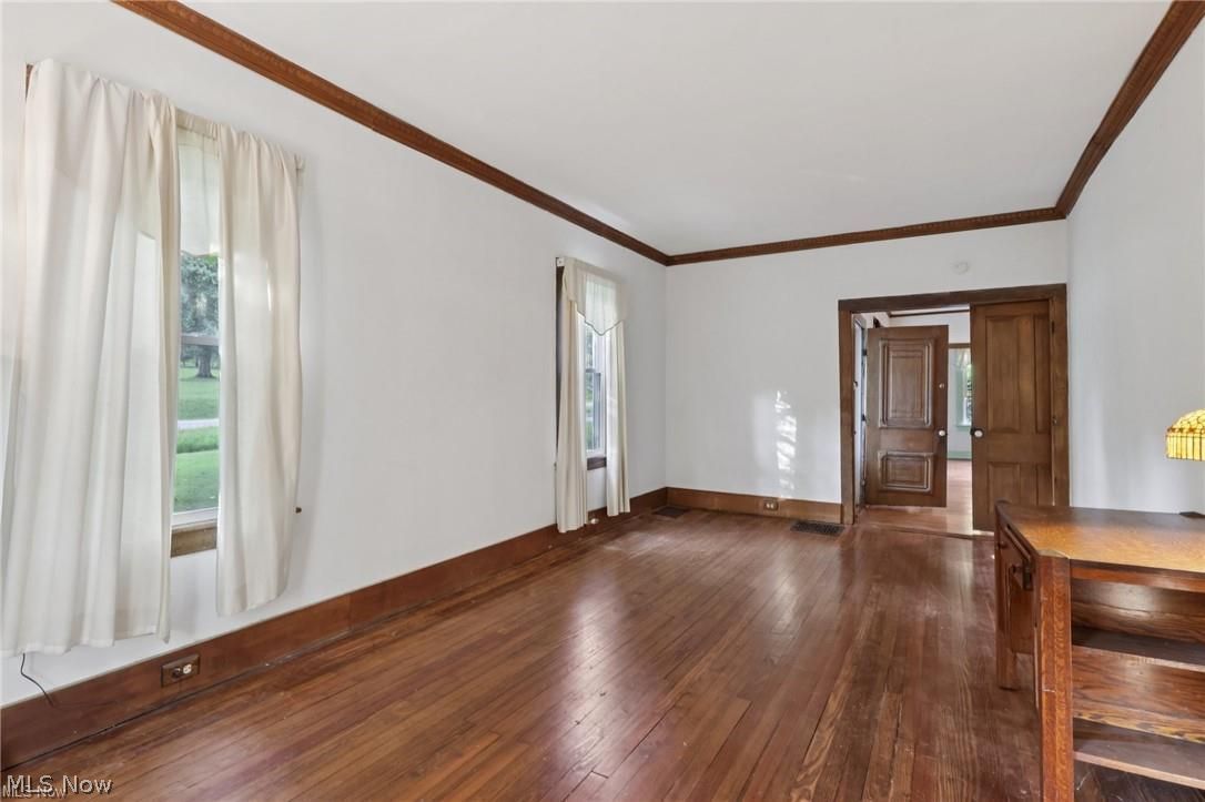 10571 Mayfield Road Chesterland, OH 44026 - Photo 11 of 39 Living Room with hardwood and crown molding.
