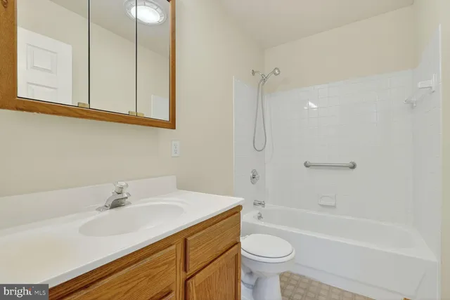 a bathroom with a sink a toilet and a bathtub