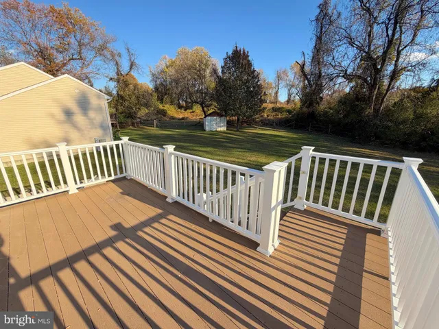 a view of balcony with wooden floor