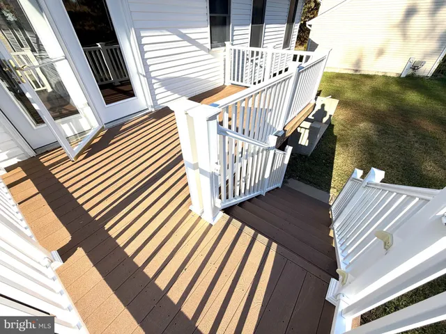 a view of balcony with wooden floor