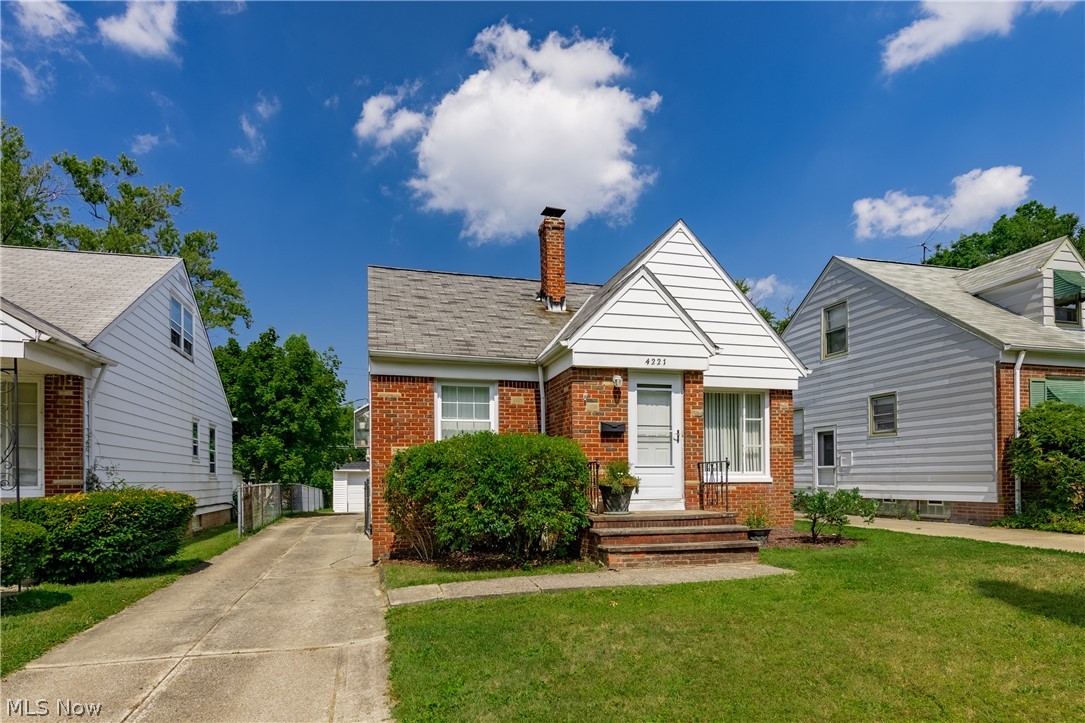 A darling 3-Bedroom Cape Cod bungalow located on a quiet, tree-lined street