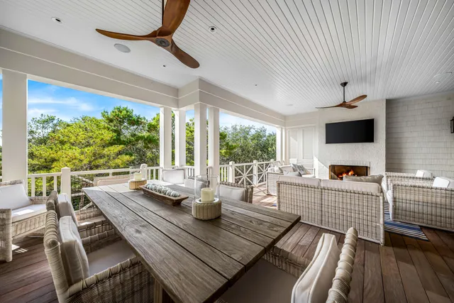 a view of a chairs and table in a balcony