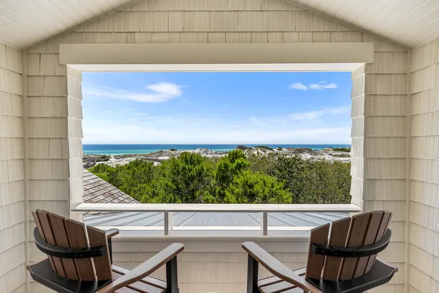 a view of a balcony with yard