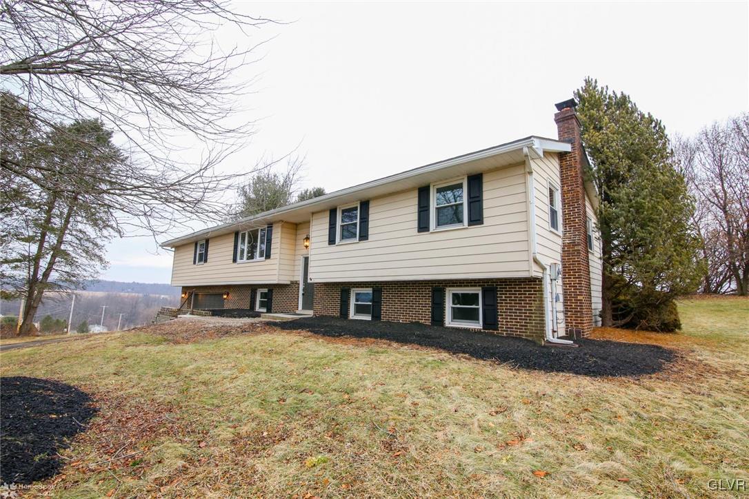 437 Hahn Road Nazareth, PA 18064 - Photo 1 of 38 a front view of a house with a yard covered with snow