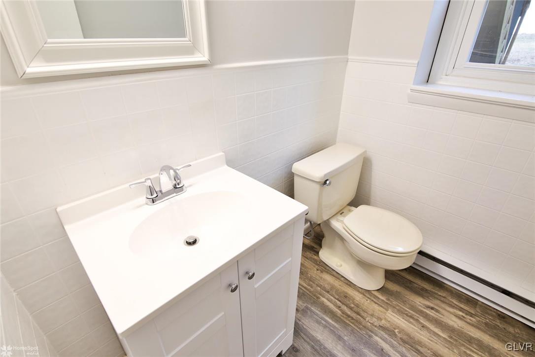 437 Hahn Road Nazareth, PA 18064 - Photo 30 of 38 a bathroom with a white toilet sitting next to a white sink