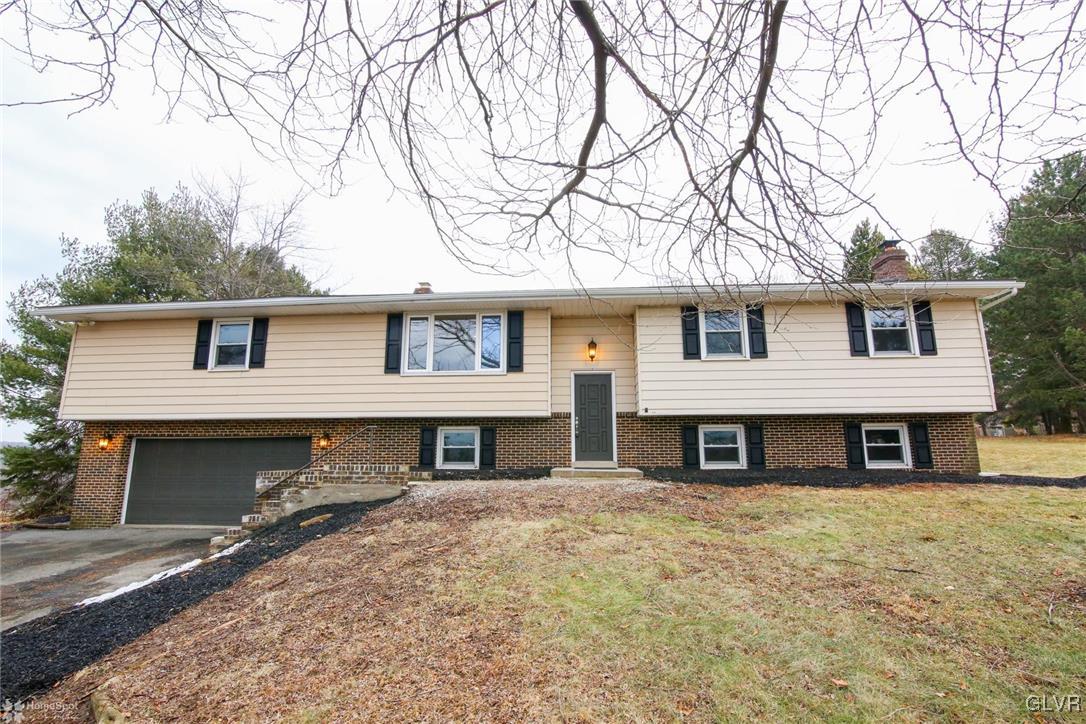437 Hahn Road Nazareth, PA 18064 - Photo 3 of 38 a front view of a house with a large tree