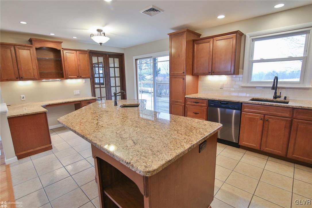 437 Hahn Road Nazareth, PA 18064 - Photo 8 of 38 a kitchen with stainless steel appliances granite countertop a sink and a stove