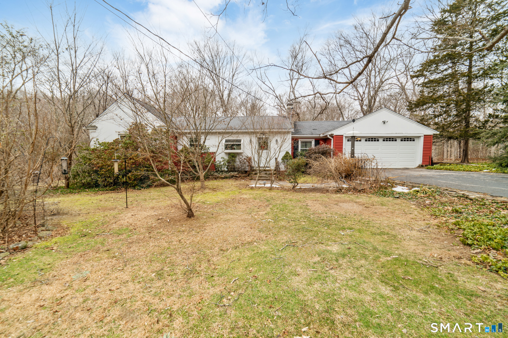 60 Hopp Brook Road Bethany, CT 06524 - Photo 1 of 1 a white house that has a tree in front of it