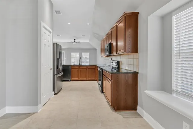 a large bathroom with a large tub and sink