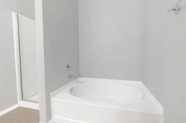 a white bath tub sitting in a bathroom