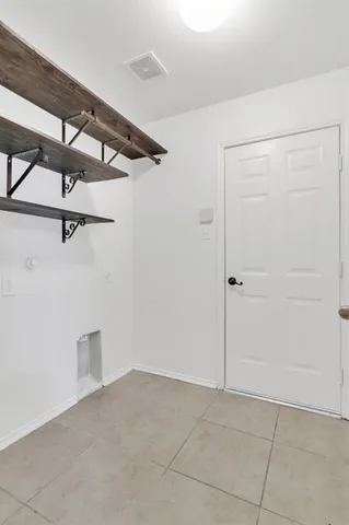 a view of a room with rack on the wall