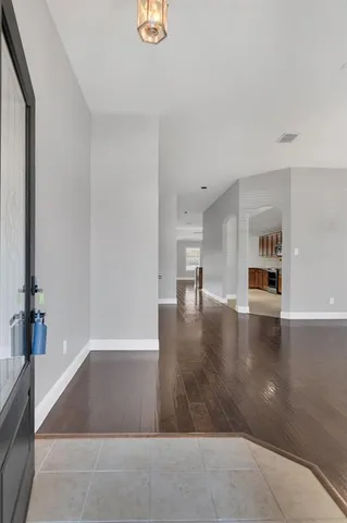 a view of a living room and hardwood floor