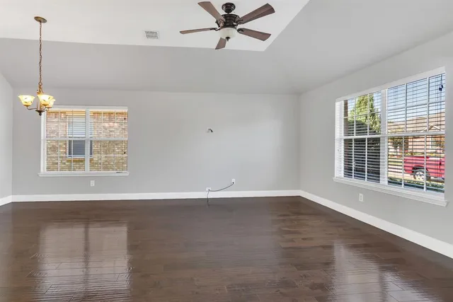 a view of an empty room with a window
