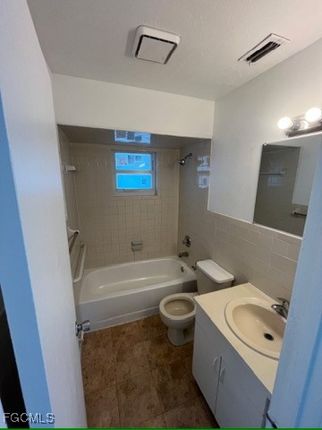 13861 First Street, Unit 13863 Fort Myers, FL 33905 - Photo 4 of 11 a bathroom with a sink a toilet a bathtub and a shower