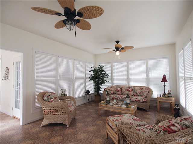 8209 Buffaloe Road Knightdale, NC 27545 - Photo 3 of 18 Welcome to the OASIS! This Sun Room is FULL OF LIGHT AND COMFORT. Peace and relaxation are waiting here for you!