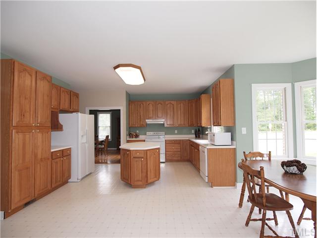 8209 Buffaloe Road Knightdale, NC 27545 - Photo 6 of 18 HUGE Kitchen with CABINET SPACE GALORE! Plenty of counter space and a CENTER ISLAND!