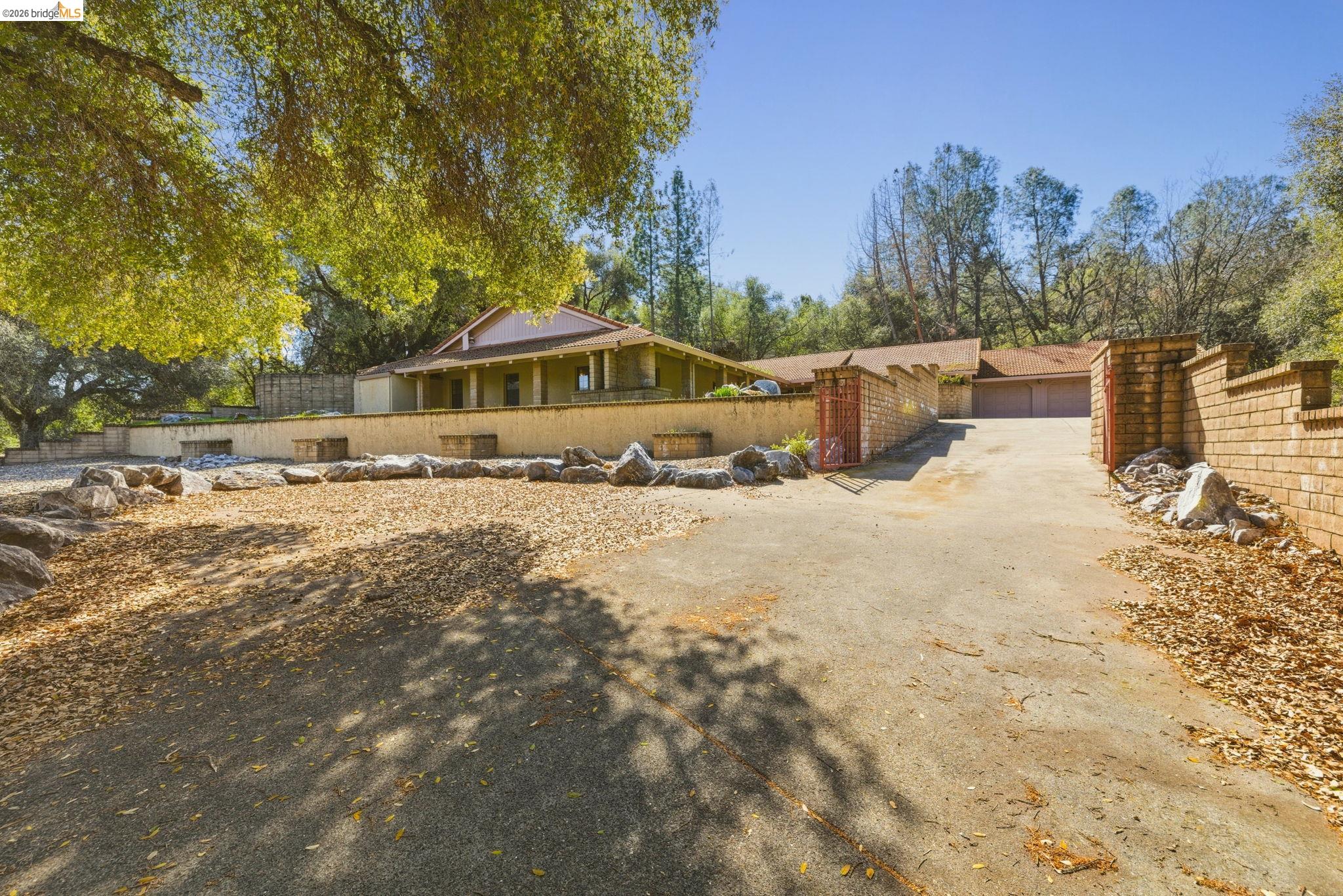 23608 Porcina Way Columbia, CA 95310 - Photo 10 of 51 a view of a house with a yard covered in snow
