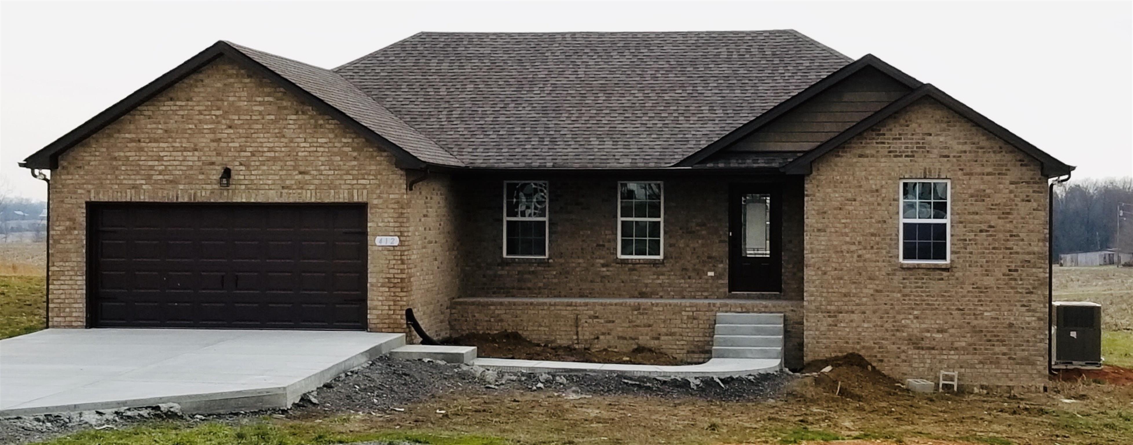 412 Fowler Ford Road Portland, TN 37148 - Photo 1 of 16 a front view of a house with garage