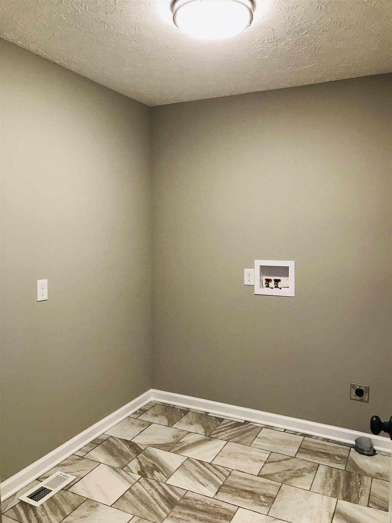 412 Fowler Ford Road Portland, TN 37148 - Photo 16 of 16 a view of a room with wooden floor