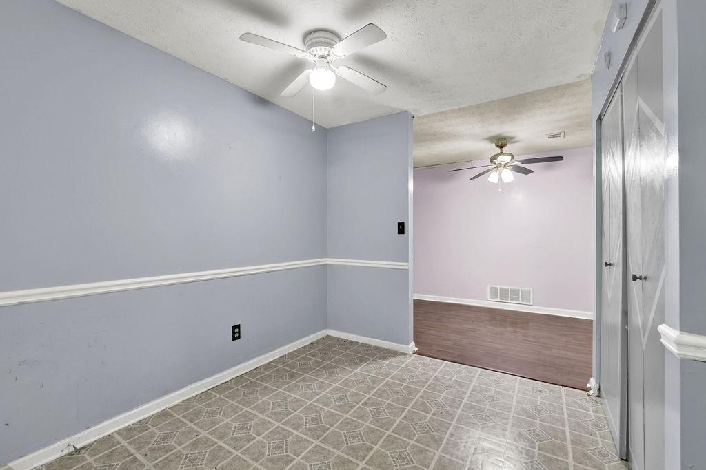 5012 Galbraith Circle Stone Mountain, GA 30088 - Photo 14 of 29 a view of a chandelier fan and entryway