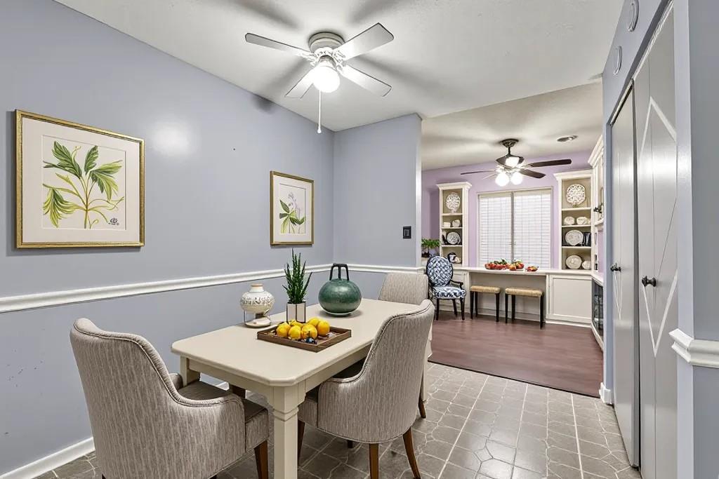 5012 Galbraith Circle Stone Mountain, GA 30088 - Photo 15 of 29 a view of a dining room with furniture and chandelier