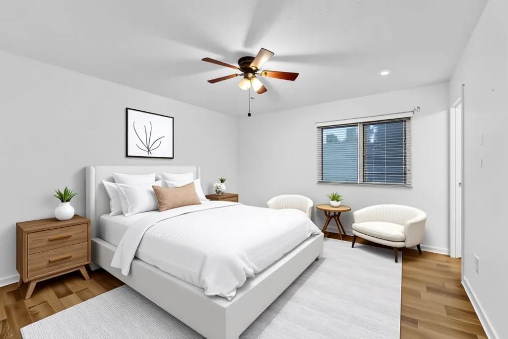 5012 Galbraith Circle Stone Mountain, GA 30088 - Photo 22 of 29 a bedroom with a bed and a chandelier