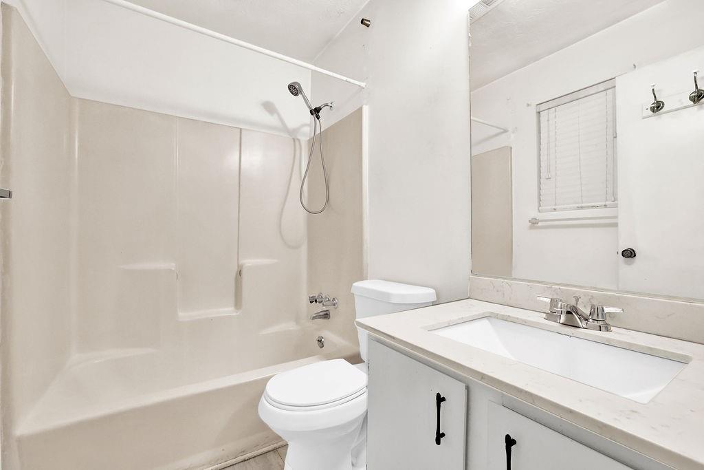 5012 Galbraith Circle Stone Mountain, GA 30088 - Photo 25 of 29 a bathroom with a sink toilet vanity and shower