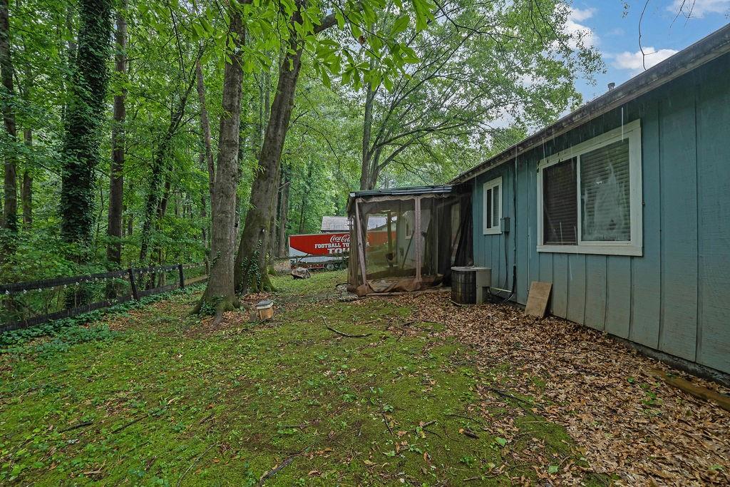 5012 Galbraith Circle Stone Mountain, GA 30088 - Photo 28 of 29 a backyard of a house with lots of green space