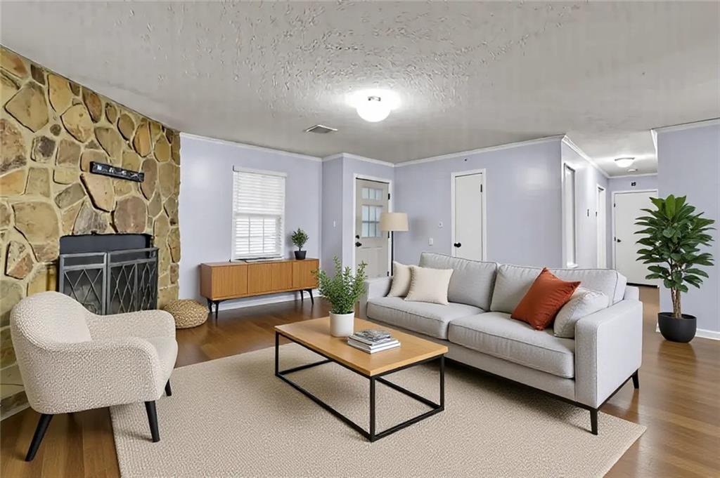 5012 Galbraith Circle Stone Mountain, GA 30088 - Photo 8 of 29 a living room with furniture and a potted plant
