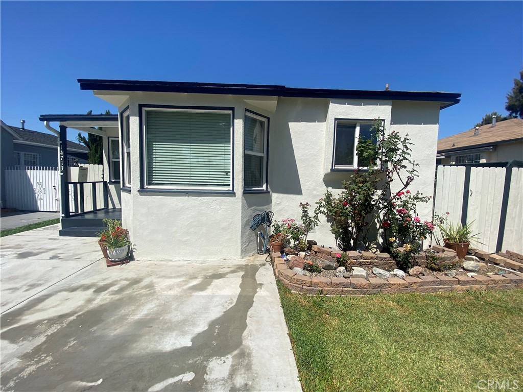 14713 South Castlegate Avenue Compton, CA 90221 - Photo 3 of 4 a view of a house with a patio