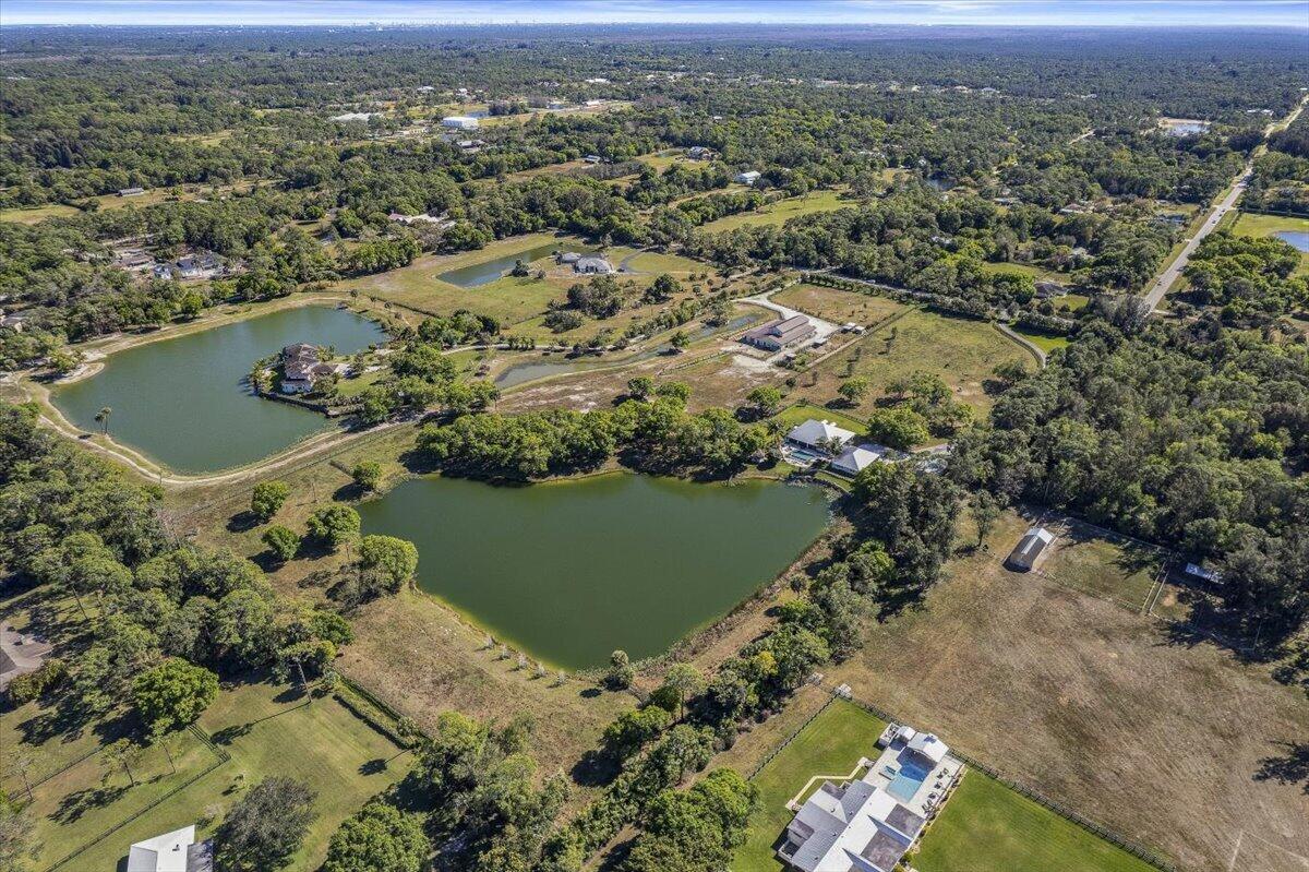 10975 Randolph Siding Road Jupiter, FL 33478 - Photo 93 of 97 an aerial view of a house with a lake view