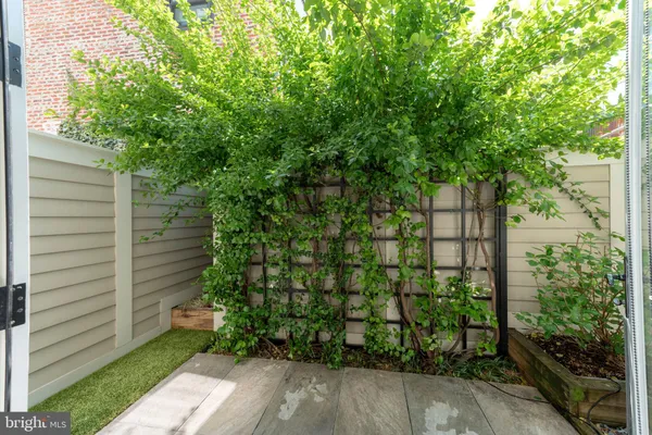 a bedroom with furniture and a large window